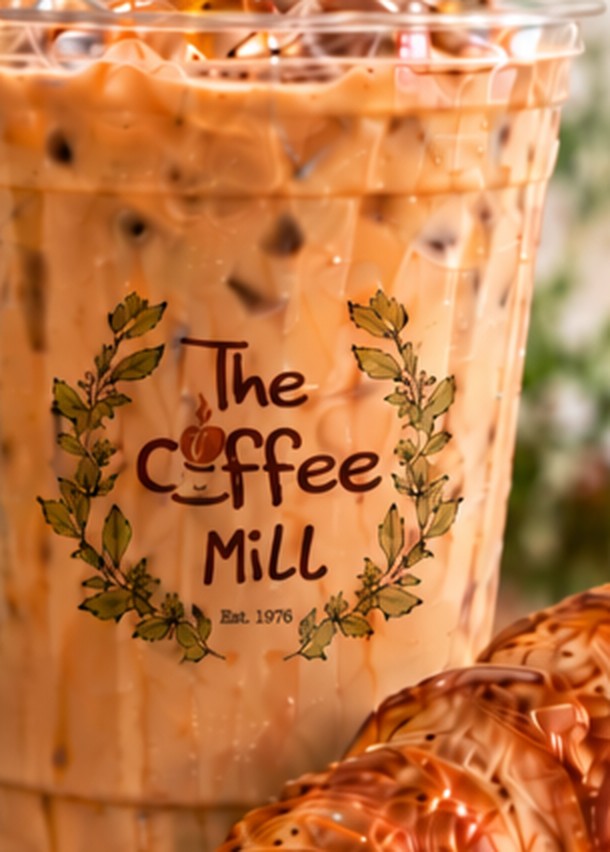 Iced coffee with The Coffee Mill logo on the cup